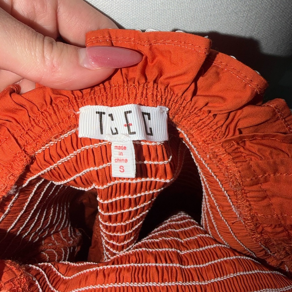 Burnt orange dress with white detail